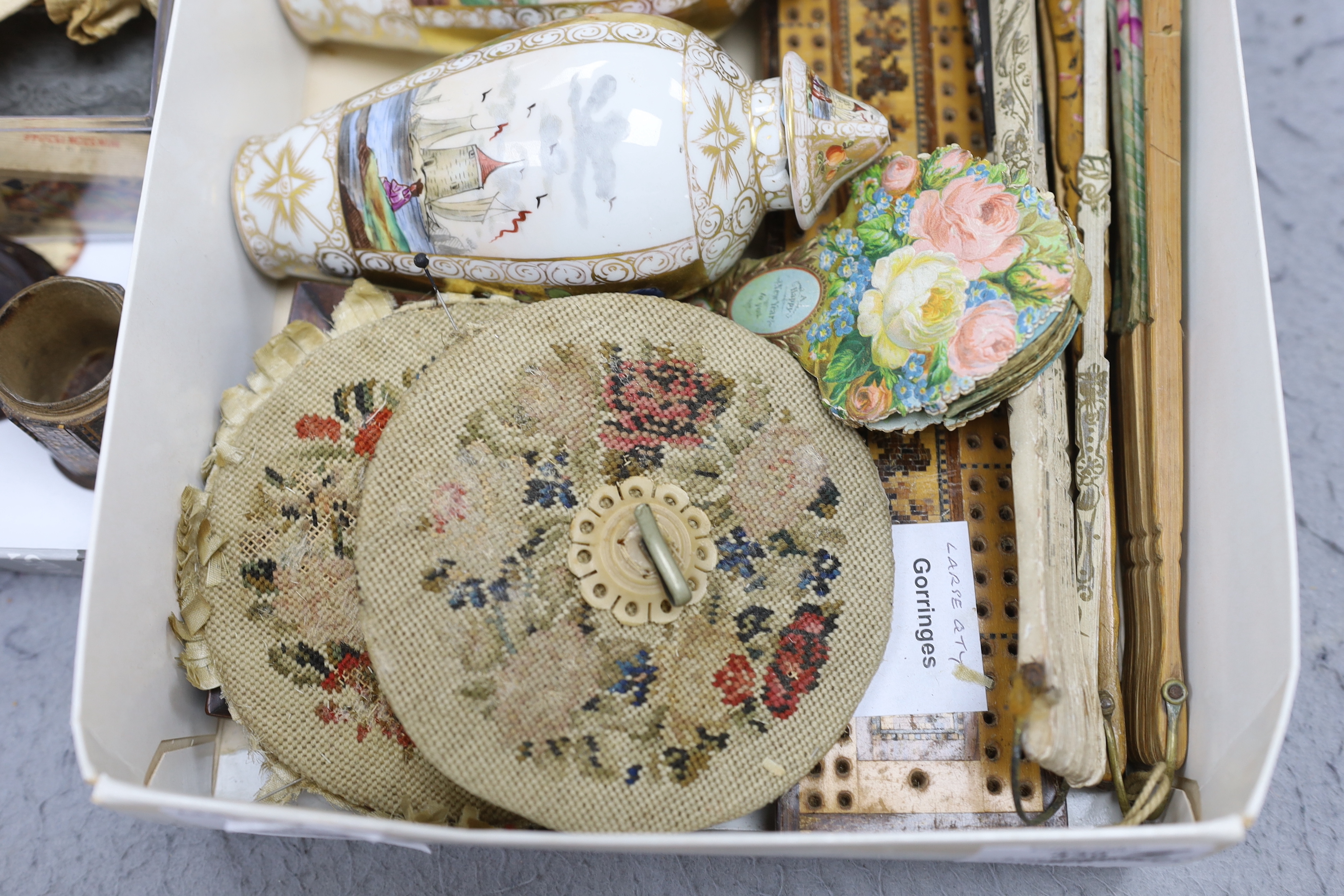A collection of cabinet curiosities, including carved lava portrait medallions, porcelain scent bottles, etc. (a large quantity)